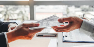 Image of people exchanging money