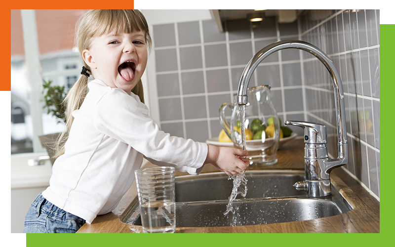 little girl with water glass