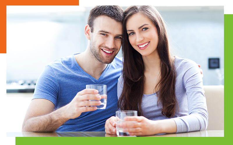 Young couple drinking water