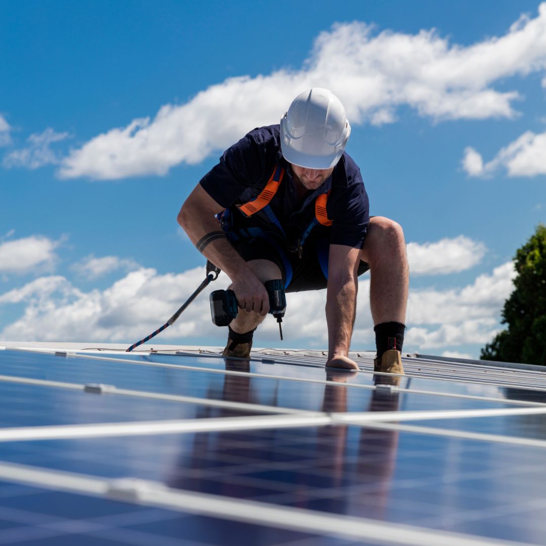 Man installing solar panels